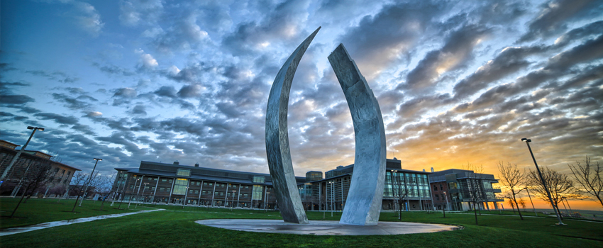 UC Merced Extension - panoramic shot of campus featuring the Beginnings sculpture.