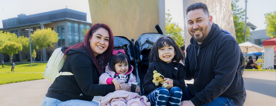 husband and wife UC Merced students with children